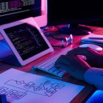 close up image programer working his desk office
